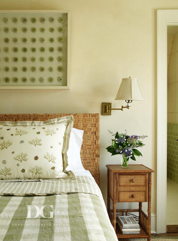 Cozy East Hampton bedroom featuring pieces from Chelsea Editions in a muted green aesthetic.