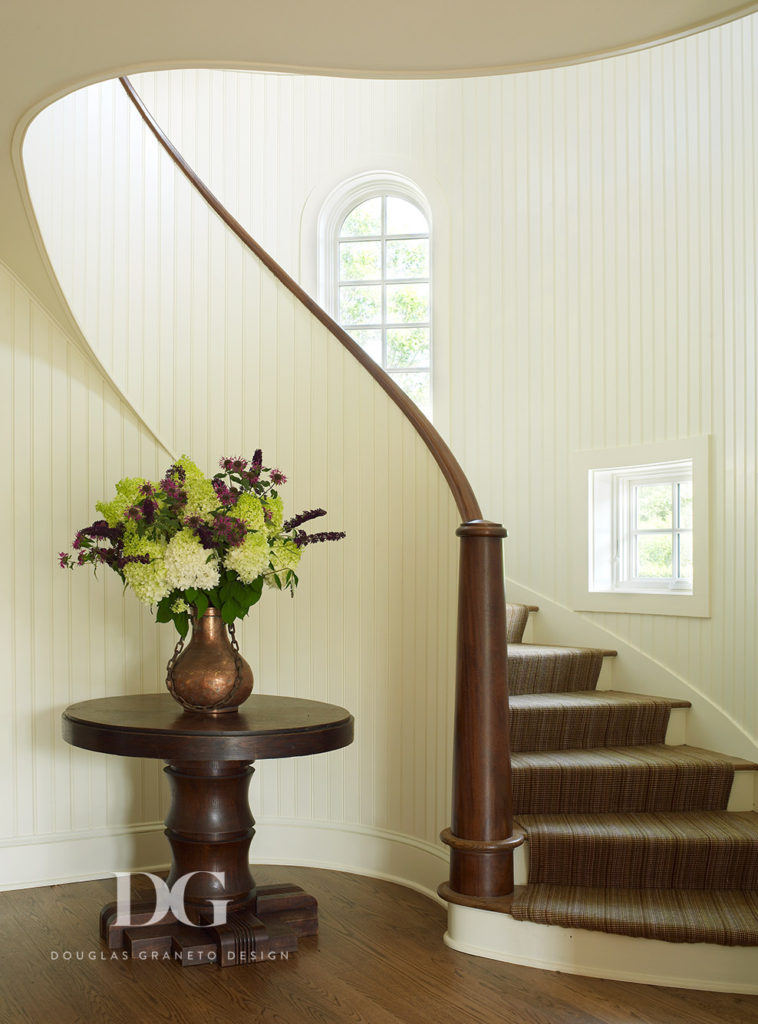 Entry staircase by Austin Patterson Disston & distinct accent table.