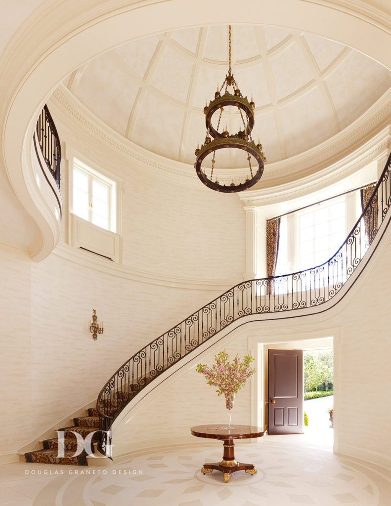 Large Foyer Featuring Suspended Lighting Fixture