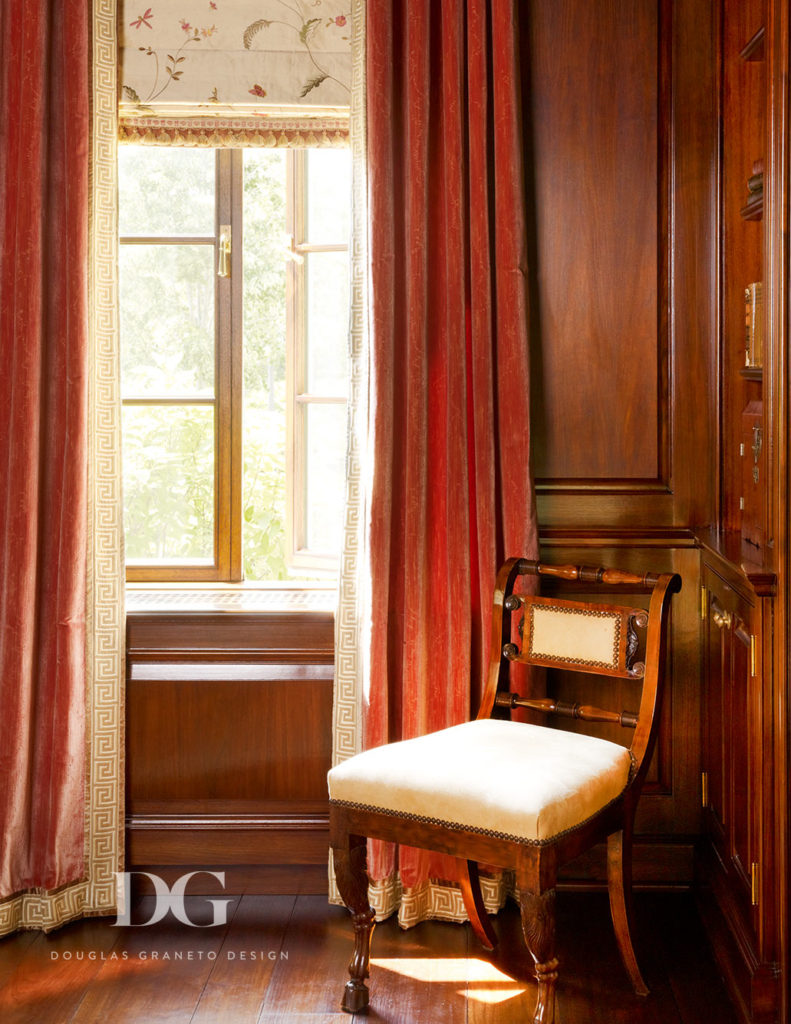 Orange drapery in a wood-finished room