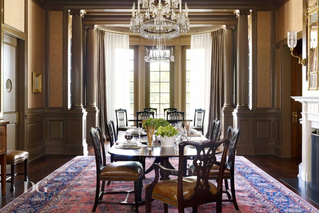 Classical Dining Room Featuring Chandelier and Vibrant Carpet