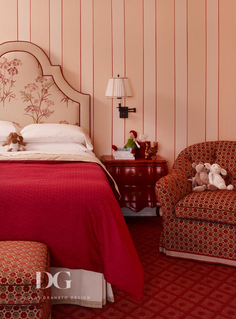 Floral headboard with red patterned bedroom set