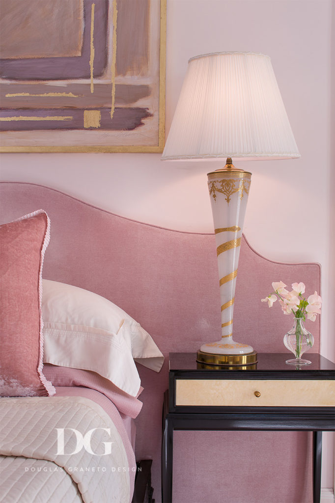custom pink headboard and fancy lamp