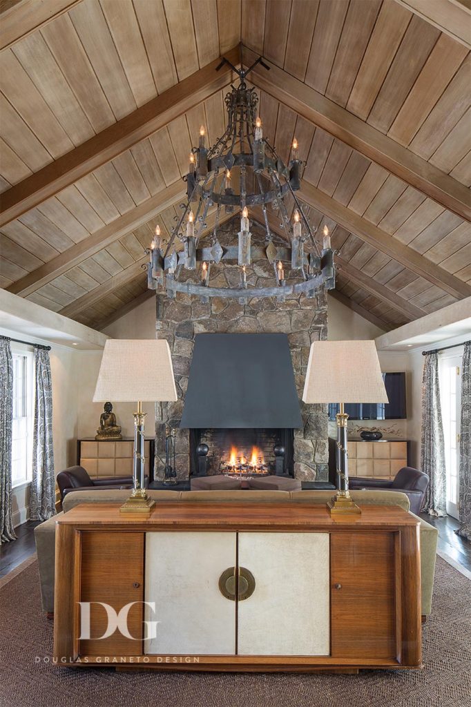 chandelier hanging from arched wood ceiling