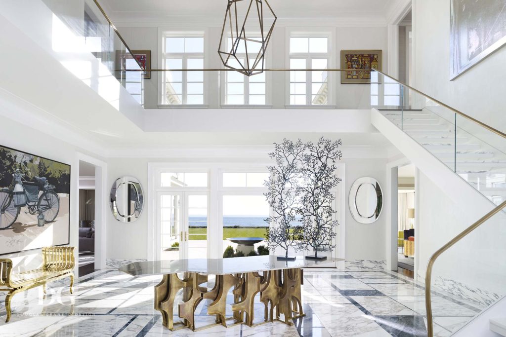 gleaming white entryway and staircase
