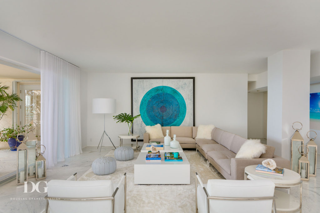 turquoise accents in all white sitting room