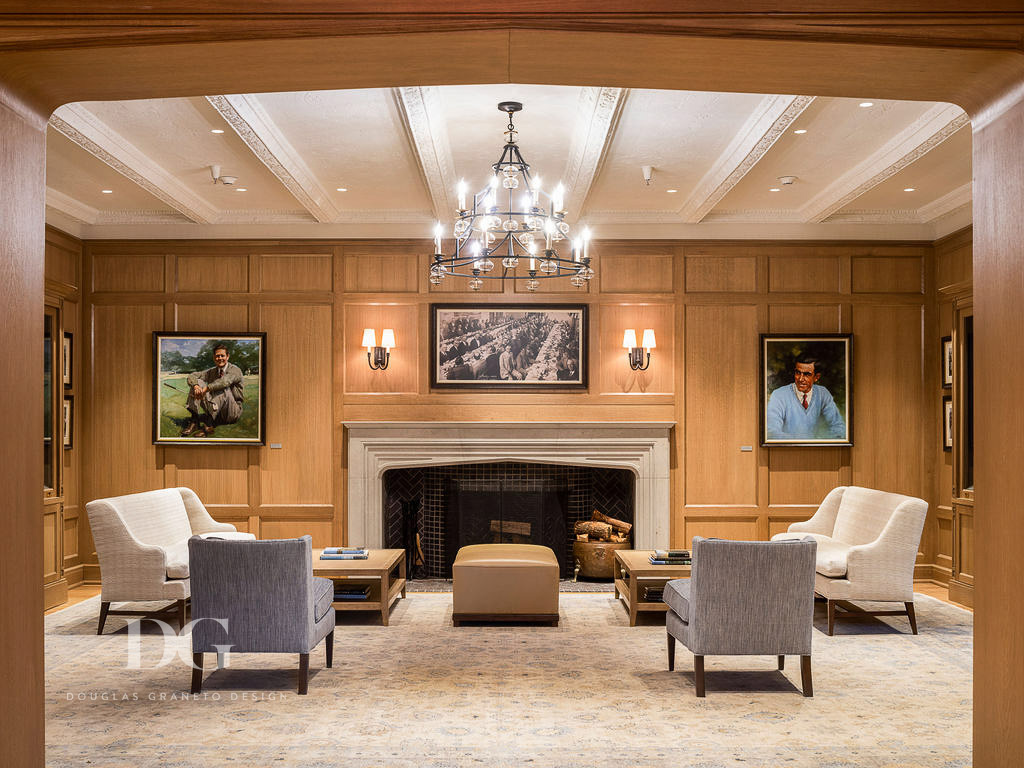 Wood panelled country club living room with custom Apadana rug, Hickory Chair settes and Cowton and Tout fabrics