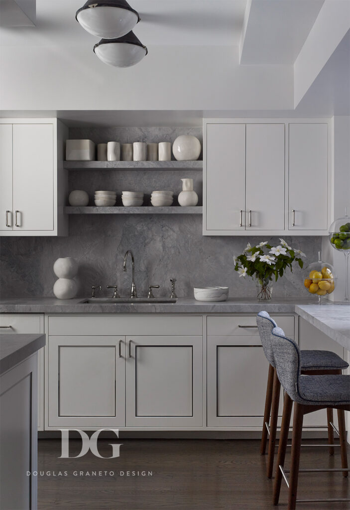 White apartment kitchen with Lepere counter stools and Urban Electric light fixtures