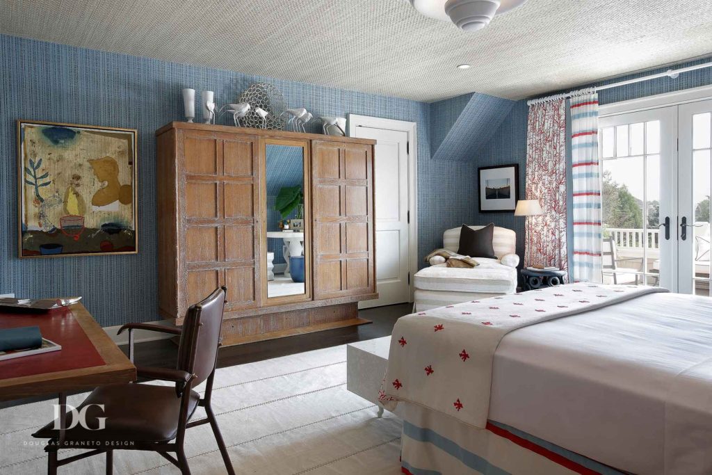 Stylish bedroom with a Jacques Adnet chair and other antiques from John Bermingham & Co, Christopher Norman, and FJ Hakimian.